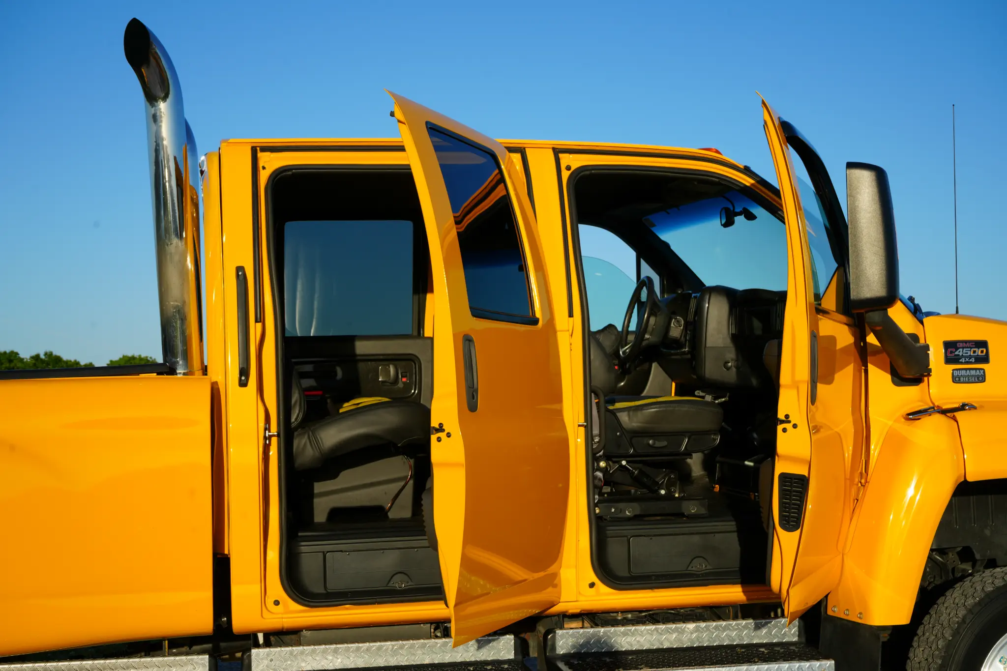 Crew cab doors open showing interior